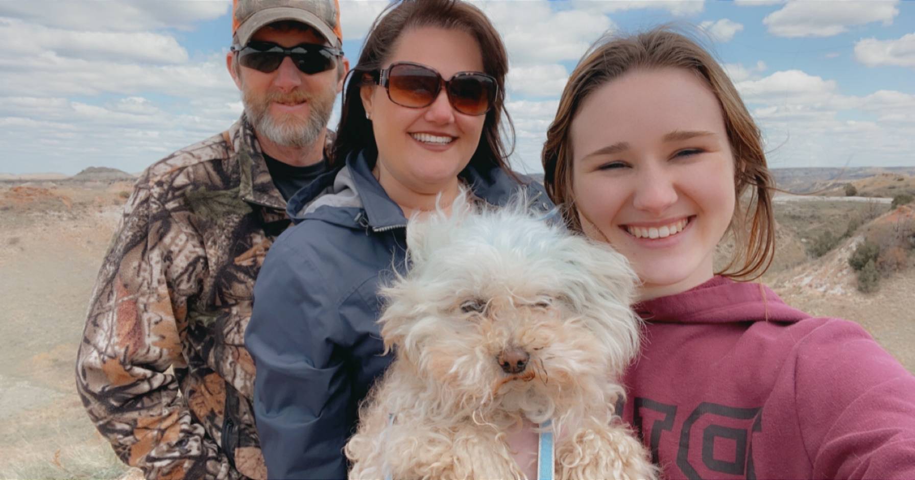 Nicole Proctor with husband, daughter and dog